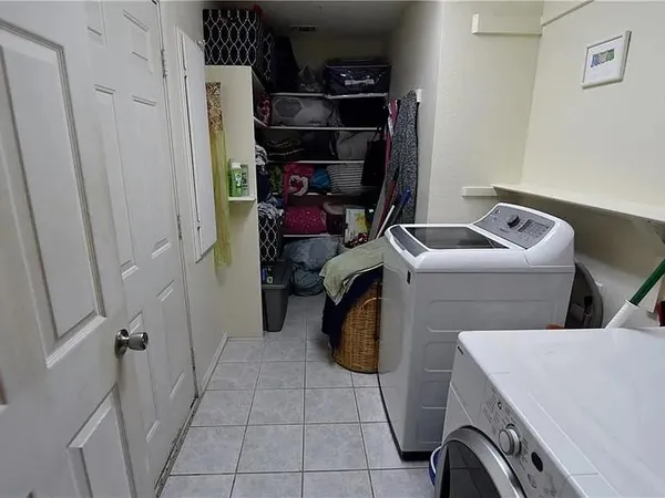 a storage room with washer and dryer