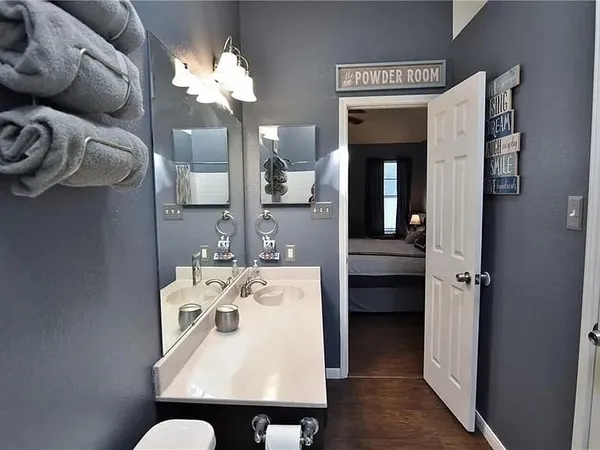 a view of a dining room with furniture and a chandelier