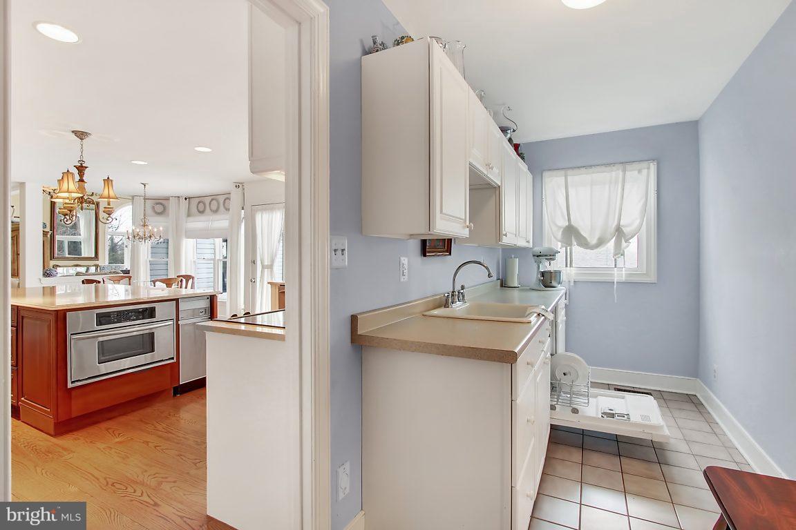 2090 Chapel Road Havre de Grace, MD 21078 - Photo 14 of 29 a kitchen with a sink stove and refrigerator