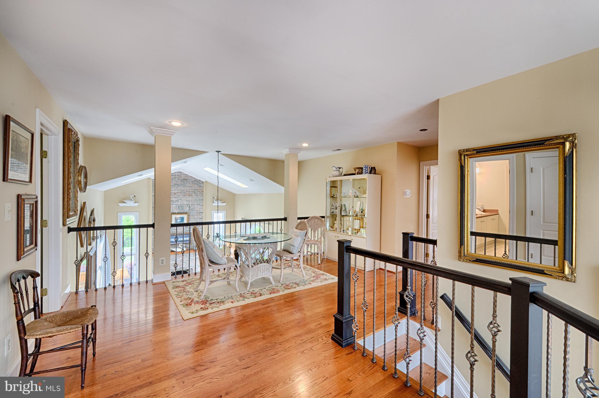 2090 Chapel Road Havre de Grace, MD 21078 - Photo 16 of 29 a view of staircase with lots of frames on wall and wooden floor