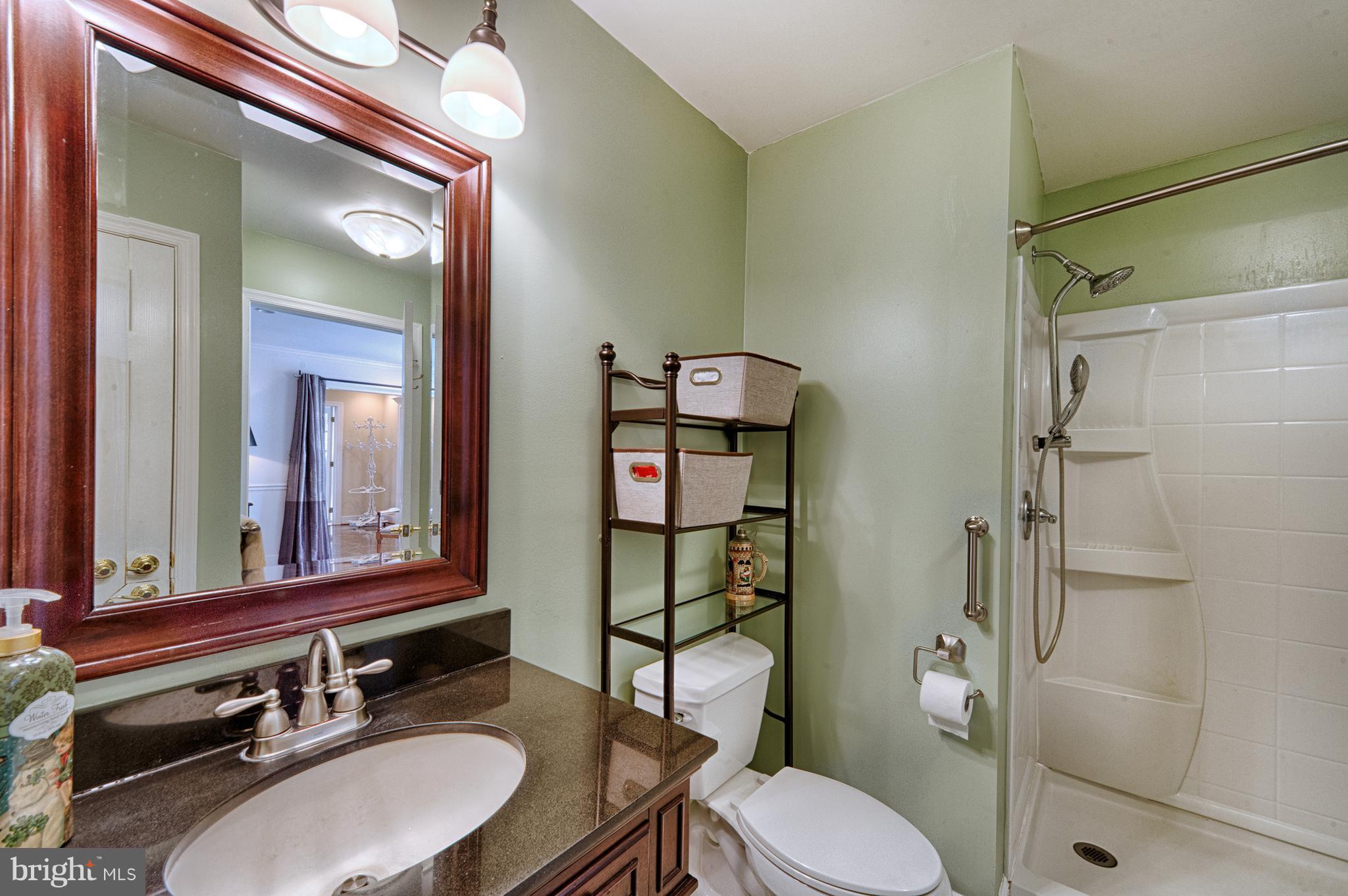 2090 Chapel Road Havre de Grace, MD 21078 - Photo 21 of 29 a bathroom with a sink toilet mirror and shower