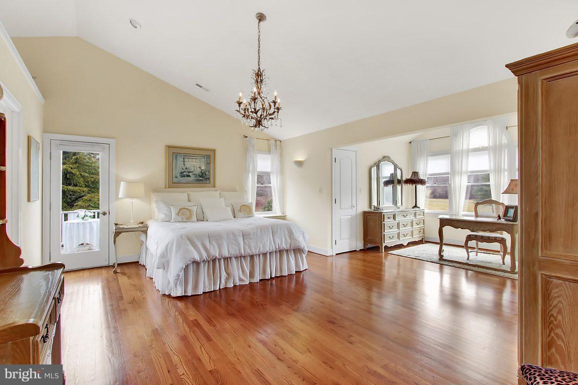 2090 Chapel Road Havre de Grace, MD 21078 - Photo 22 of 29 a spacious bedroom with a bed and wooden floor