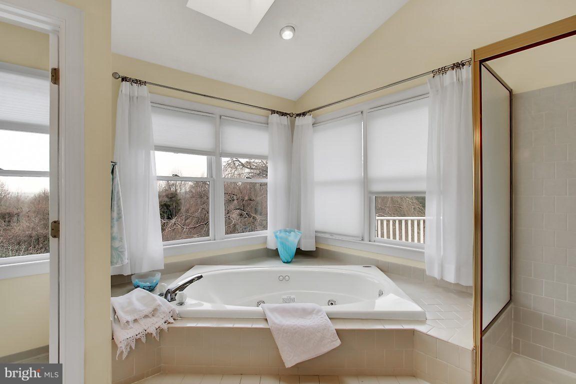 2090 Chapel Road Havre de Grace, MD 21078 - Photo 24 of 29 a bathroom with a tub sink and a window