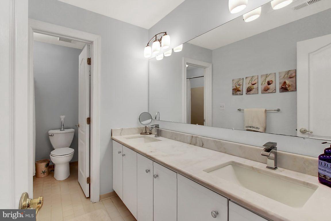 2090 Chapel Road Havre de Grace, MD 21078 - Photo 27 of 29 a bathroom with a toilet a sink and mirror