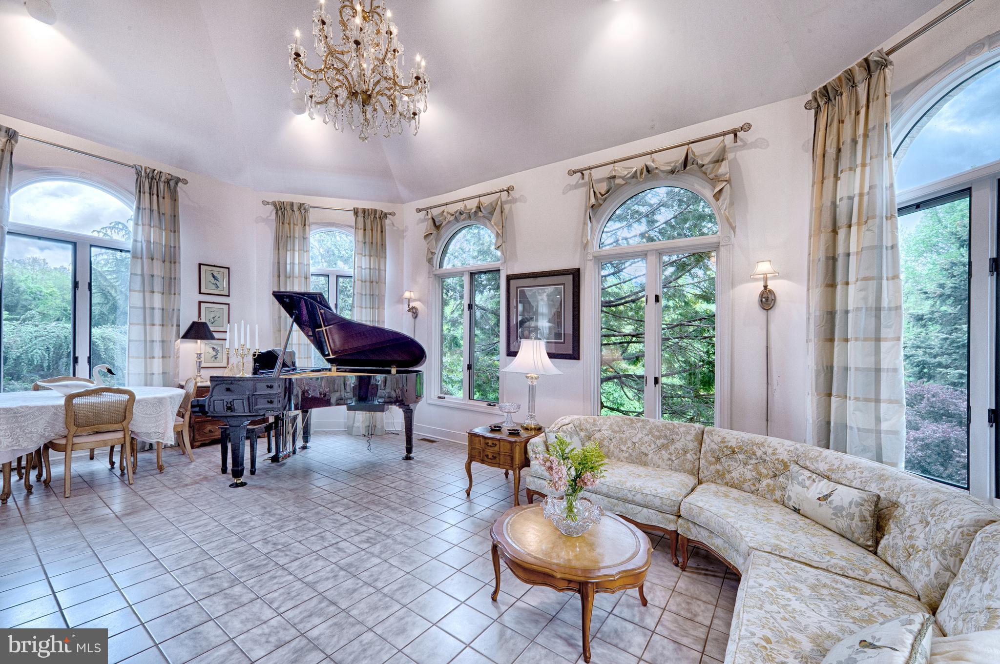 2090 Chapel Road Havre de Grace, MD 21078 - Photo 6 of 29 a living room with furniture a chandelier and a large window