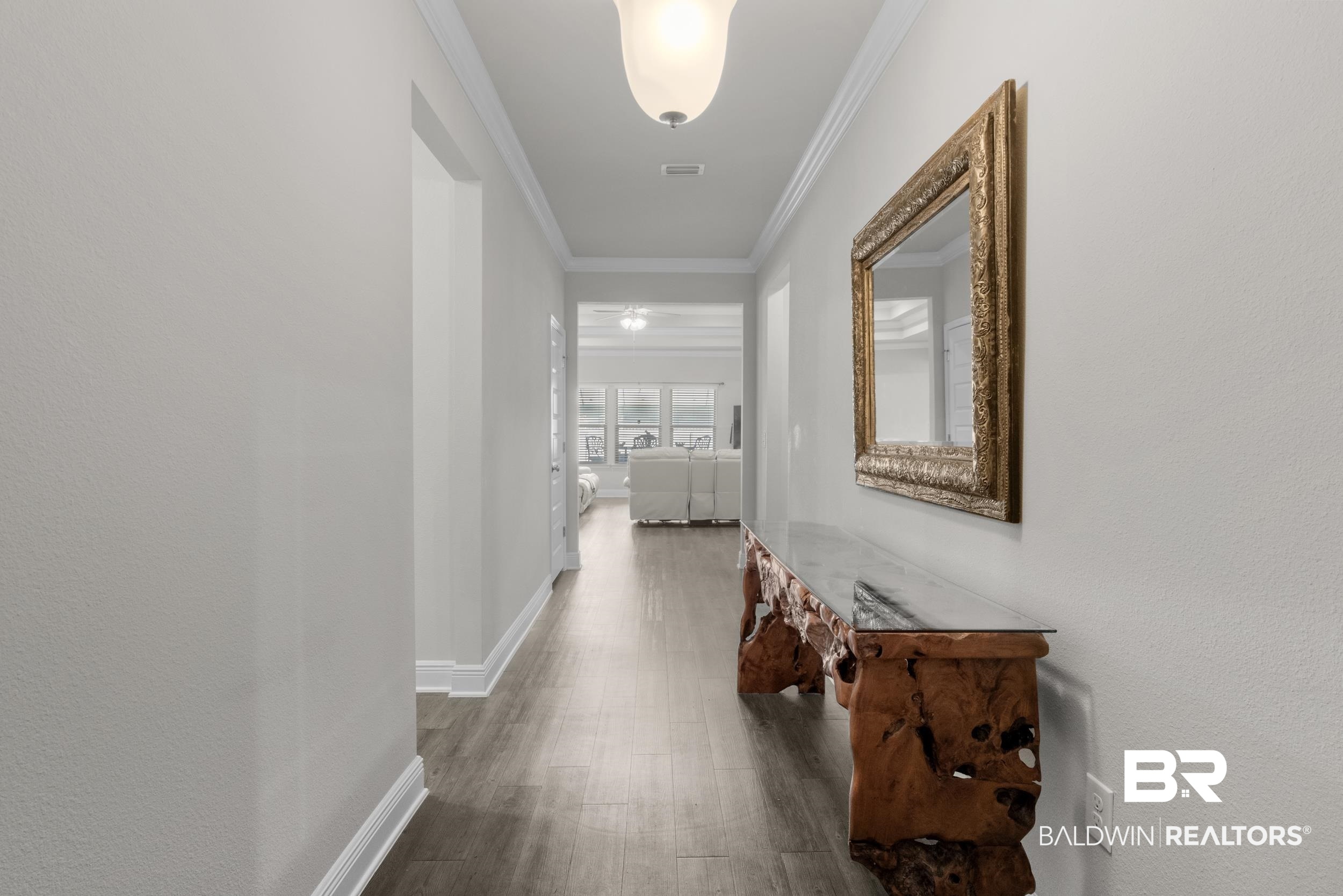 2050 Bourbon Street Foley, AL 36535 - Photo 22 of 32 Hall with crown molding and dark wood-type flooring