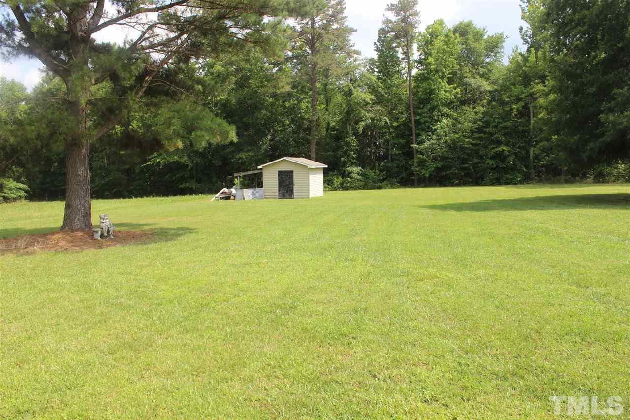 1306 Jones Store Road Roxboro, NC 27574 - Photo 22 of 22 a view of a big yard with large trees
