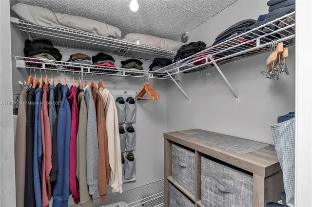 a view of a closet with storage