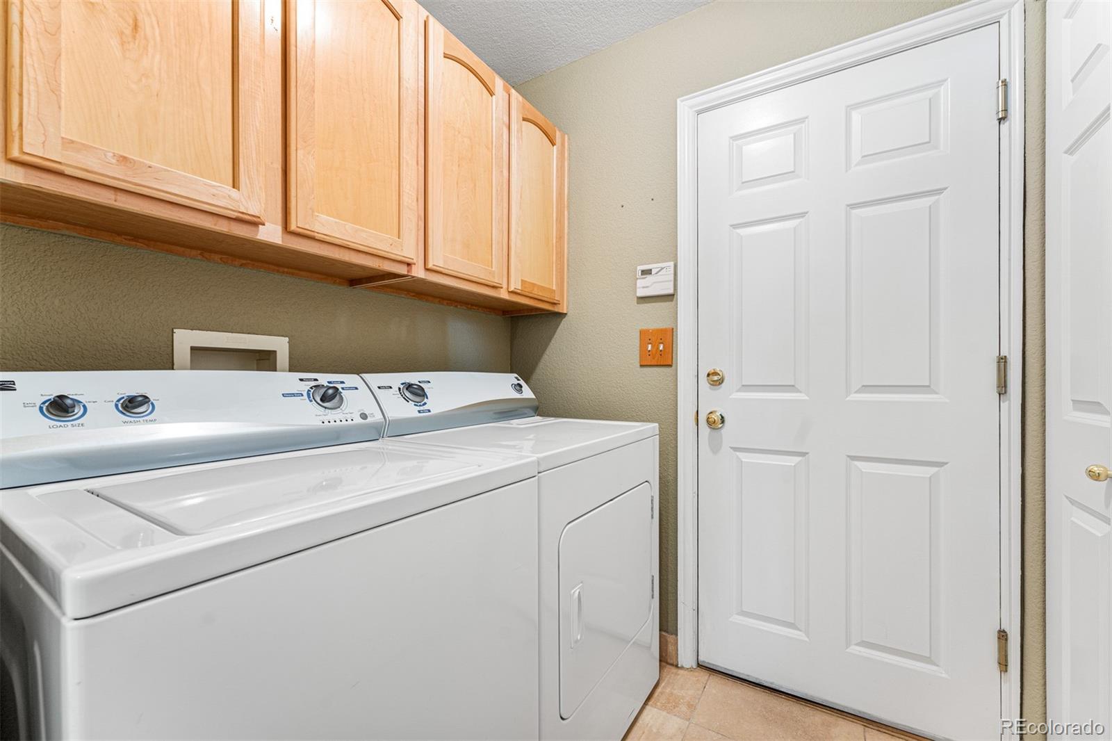 8300 Fairmount Drive, Unit 103 Denver, CO 80247 - Photo 15 of 34 a utility room with dryer and washer
