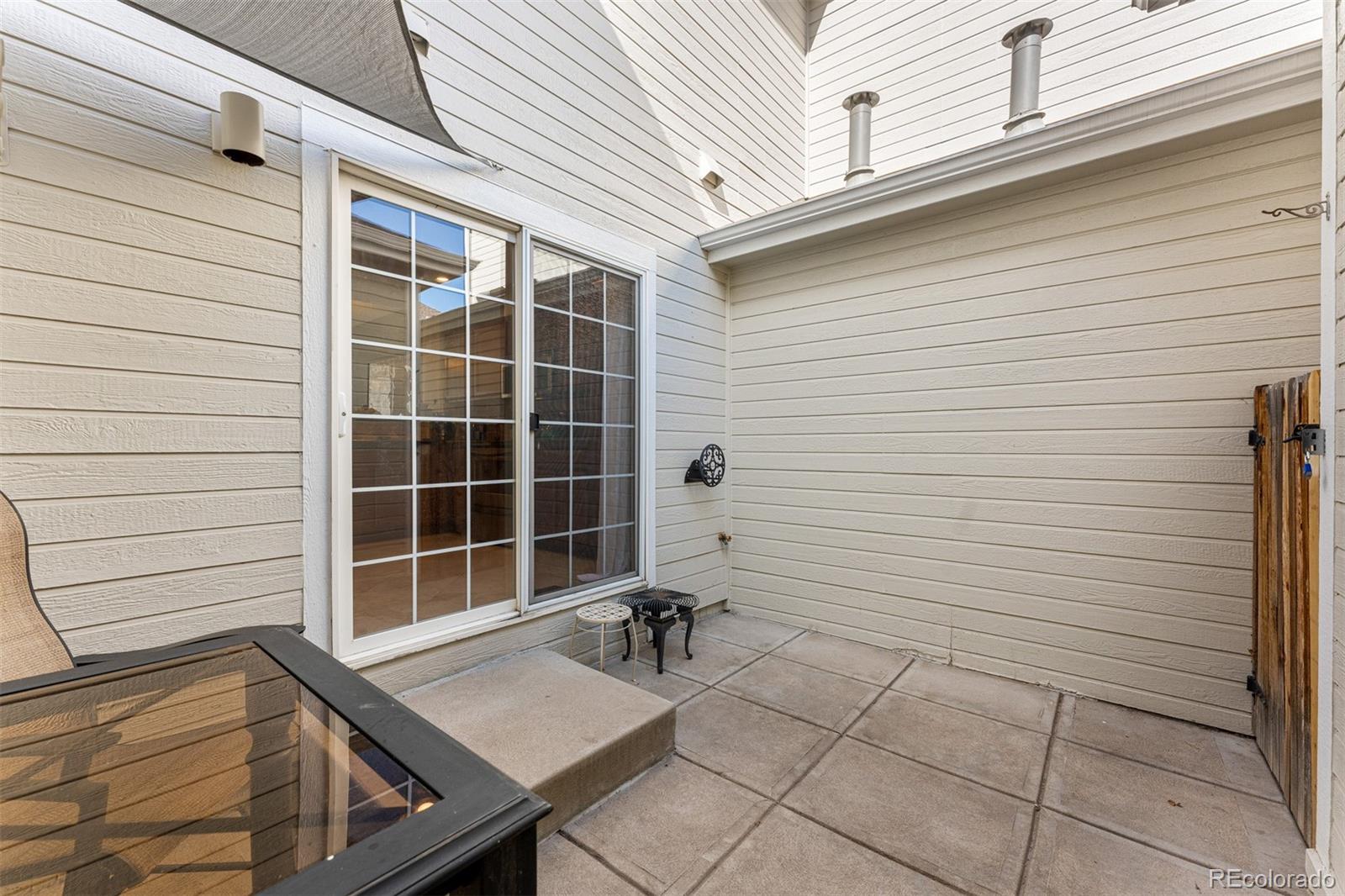 8300 Fairmount Drive, Unit 103 Denver, CO 80247 - Photo 27 of 34 a view of a door and a chair