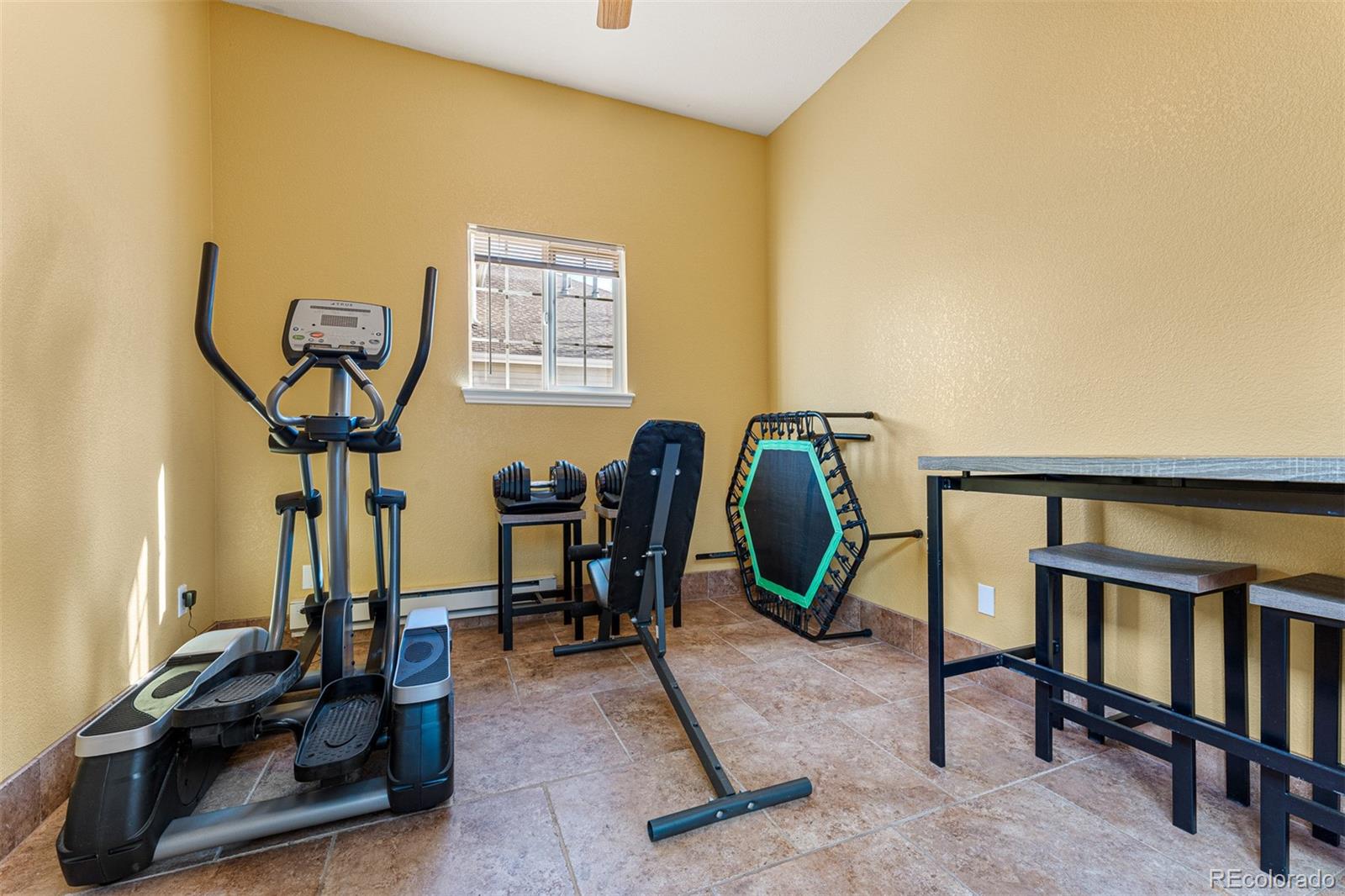 8300 Fairmount Drive, Unit 103 Denver, CO 80247 - Photo 28 of 34 a view of a room with gym equipment