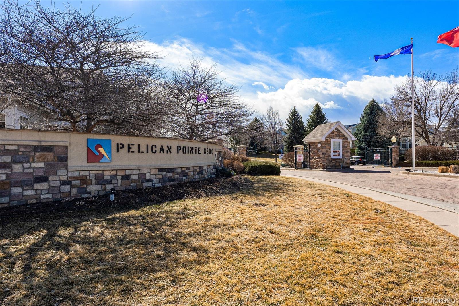 8300 Fairmount Drive, Unit 103 Denver, CO 80247 - Photo 33 of 34 a street view with residential house and car parked