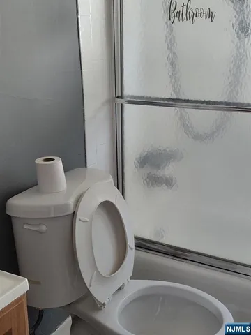 a bathroom with a toilet and a sink