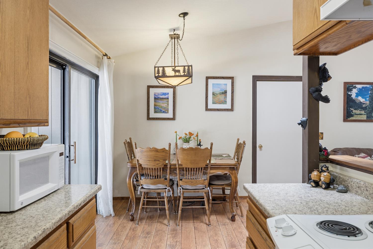 4838 Golden Street Pollock Pines, CA 95726 - Photo 11 of 35 a view of a dining room with furniture and wooden floor