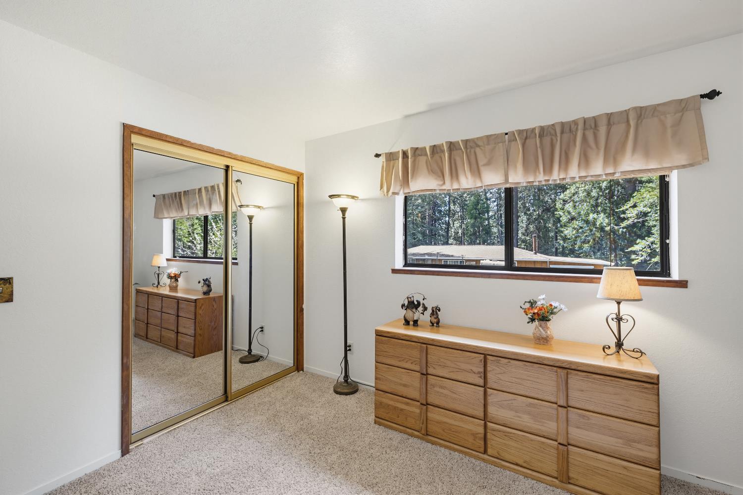 4838 Golden Street Pollock Pines, CA 95726 - Photo 19 of 35 a room with a window and a mirror