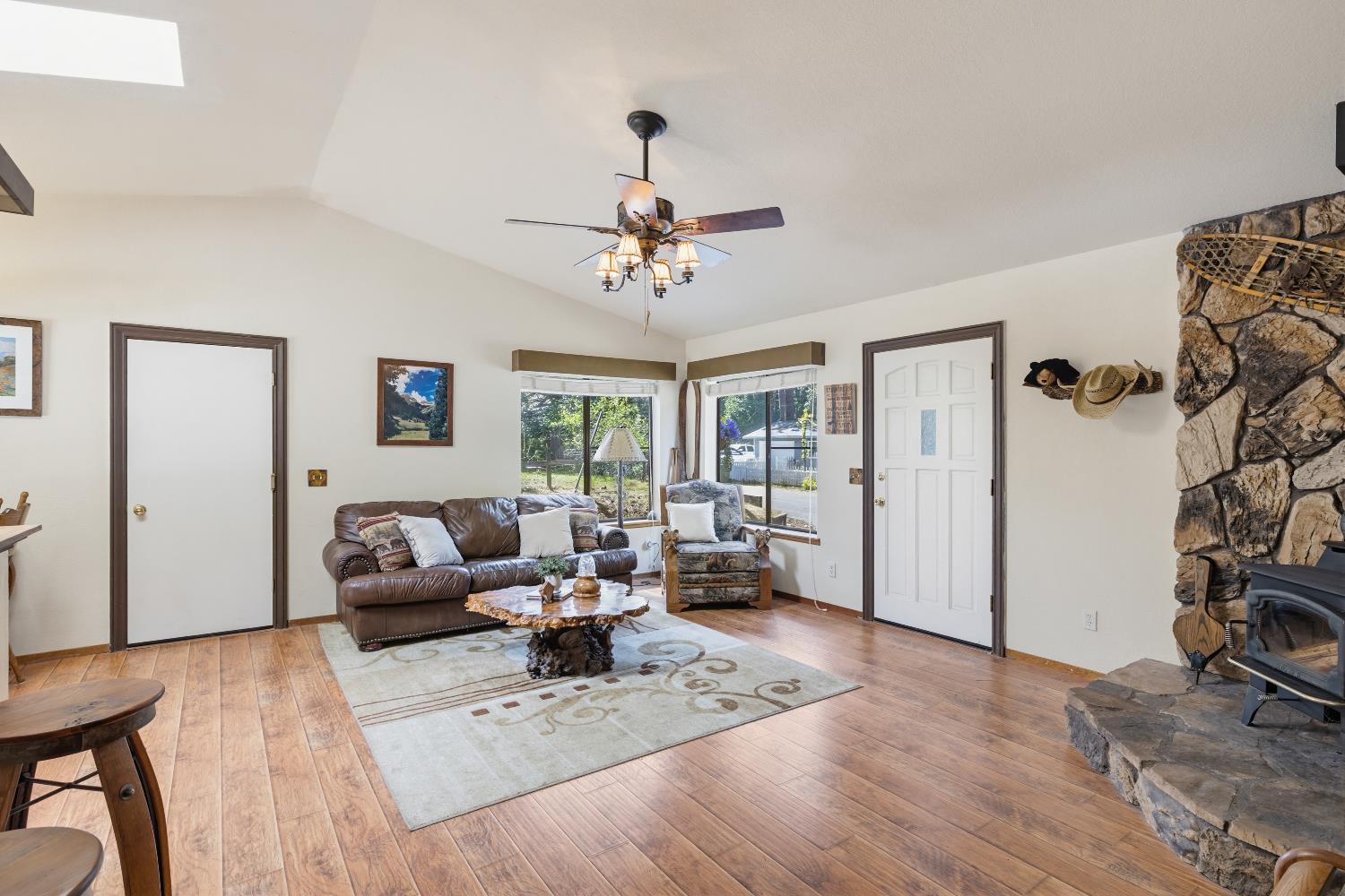 4838 Golden Street Pollock Pines, CA 95726 - Photo 6 of 35 a living room with furniture hard wood floor and a ceiling fan
