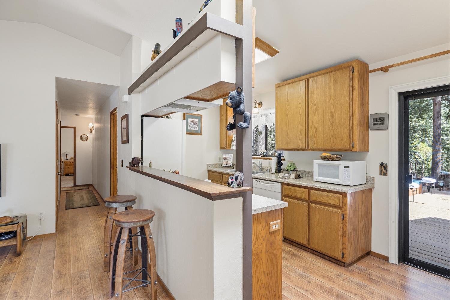 4838 Golden Street Pollock Pines, CA 95726 - Photo 8 of 35 a kitchen with granite countertop a sink a counter top space and stainless steel appliances