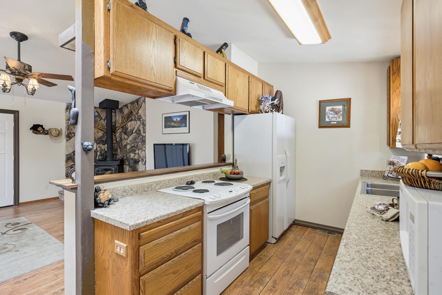 4838 Golden Street Pollock Pines, CA 95726 - Photo 10 of 35 a kitchen that has a stove and a refrigerator