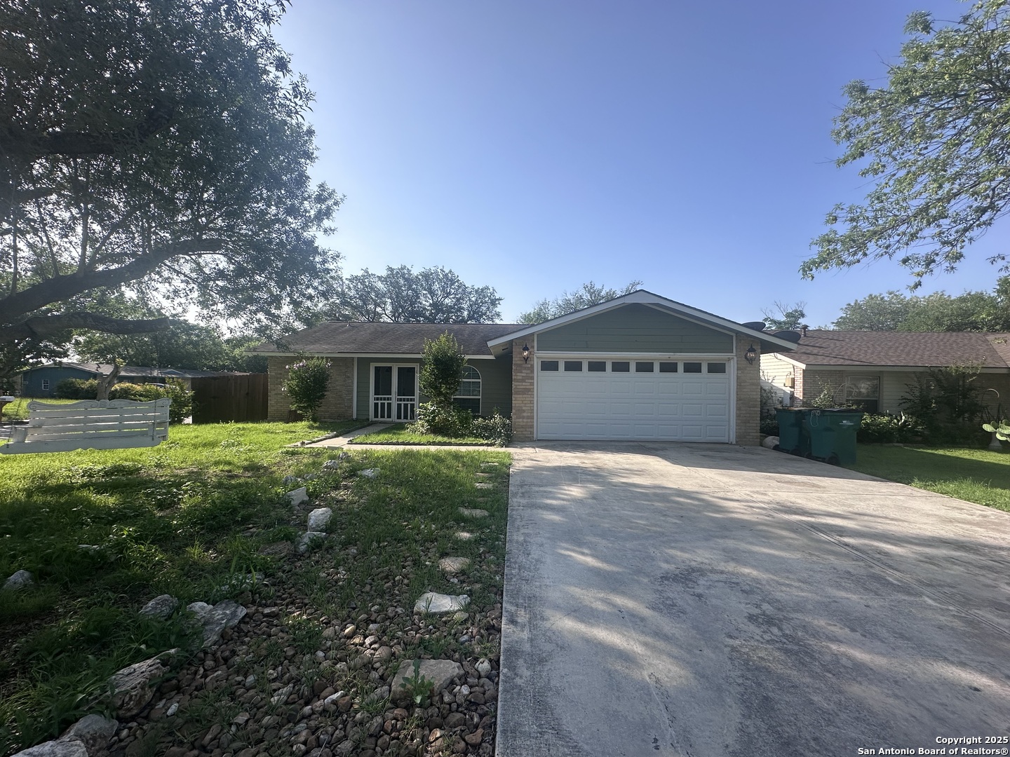 502 Erna Drive Converse, TX 78109 - Photo 1 of 1 a front view of a house with a yard and garage