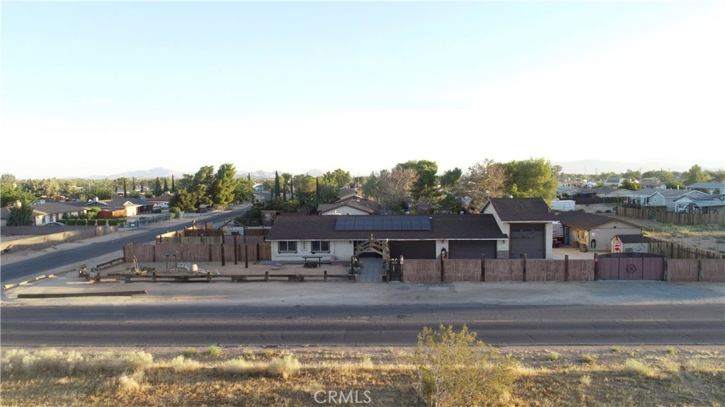 21584 Tussing Ranch Road Apple Valley, CA 92308 - Photo 1 of 1 a view of swimming pool with a yard and seating area