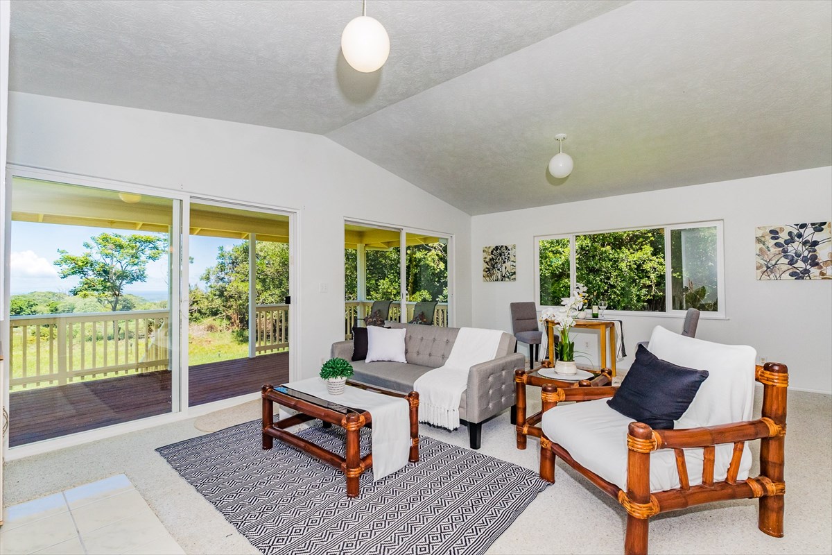 455 Akolea Road Hilo, HI 96720 - Photo 11 of 29 a living room with furniture and a large window