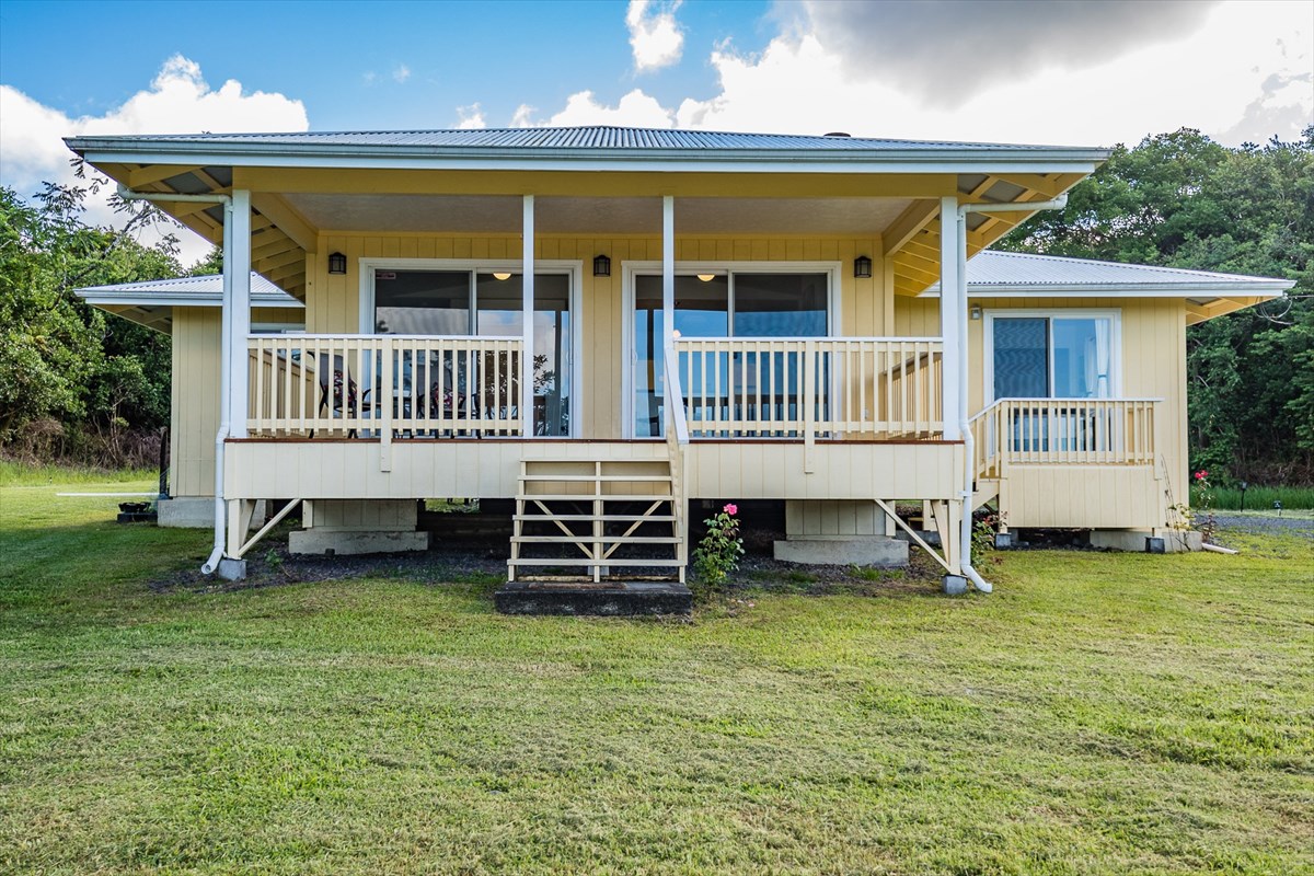 455 Akolea Road Hilo, HI 96720 - Photo 2 of 29 front view of a house with a yard