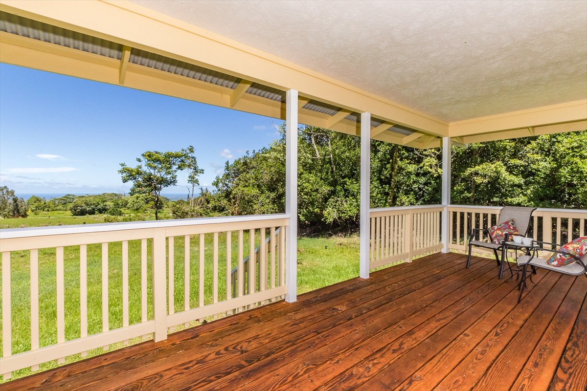 455 Akolea Road Hilo, HI 96720 - Photo 6 of 29 a view of a wooden deck with a yard