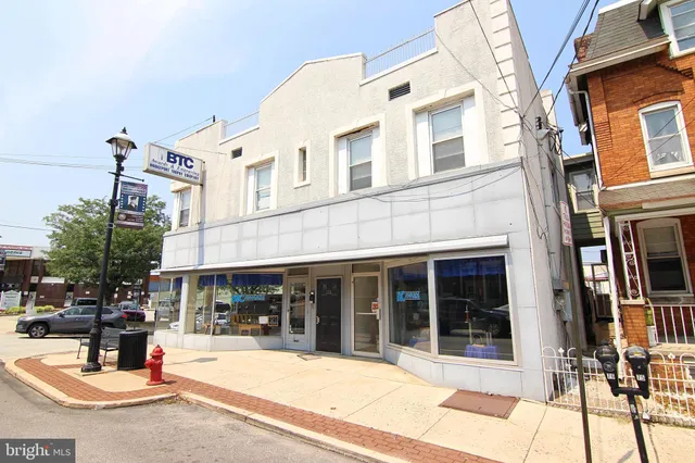 a view of a building with sitting area