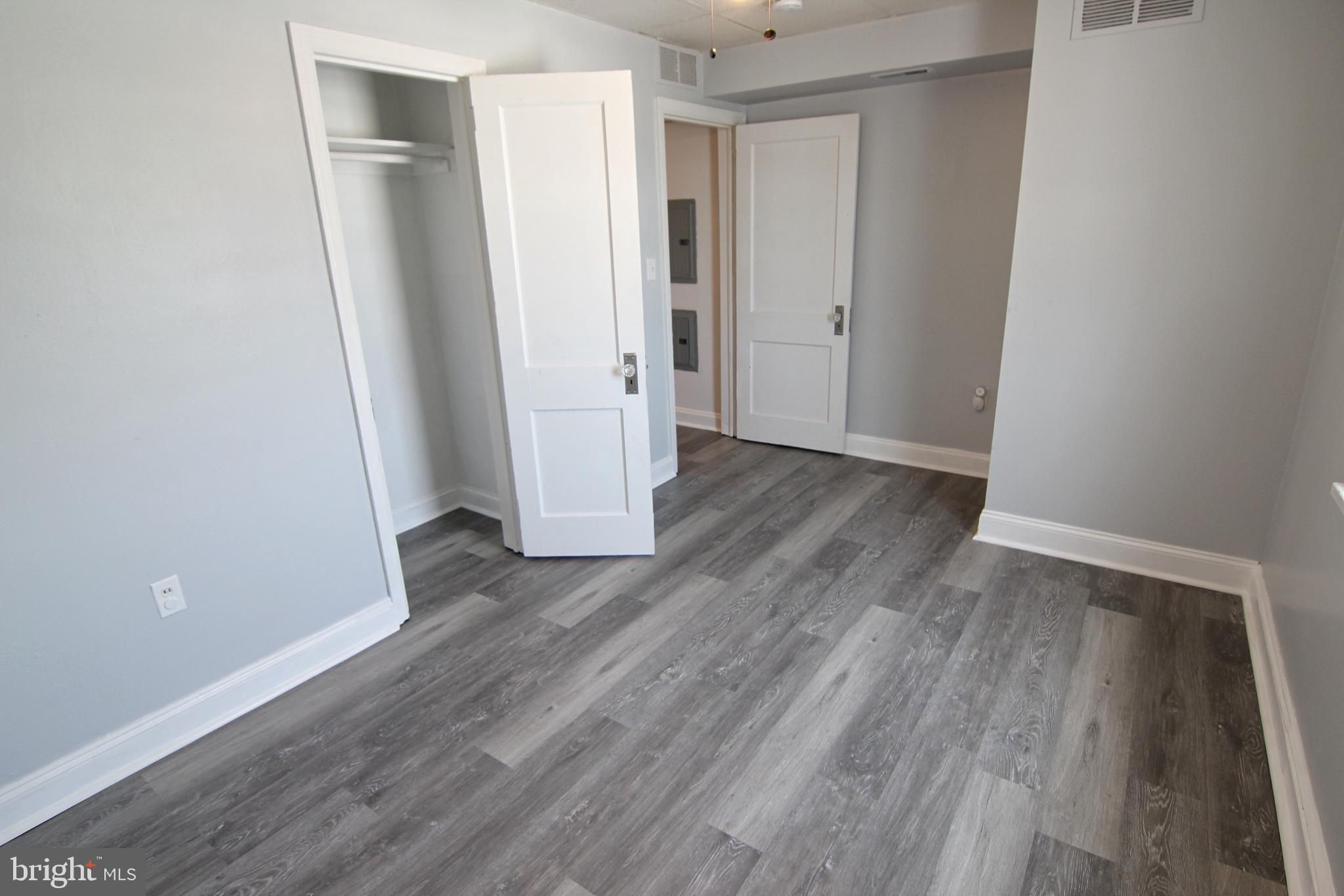135 West 4th Street, Unit 2E Bridgeport, PA 19405 - Photo 11 of 11 a view of wooden floor in an empty room