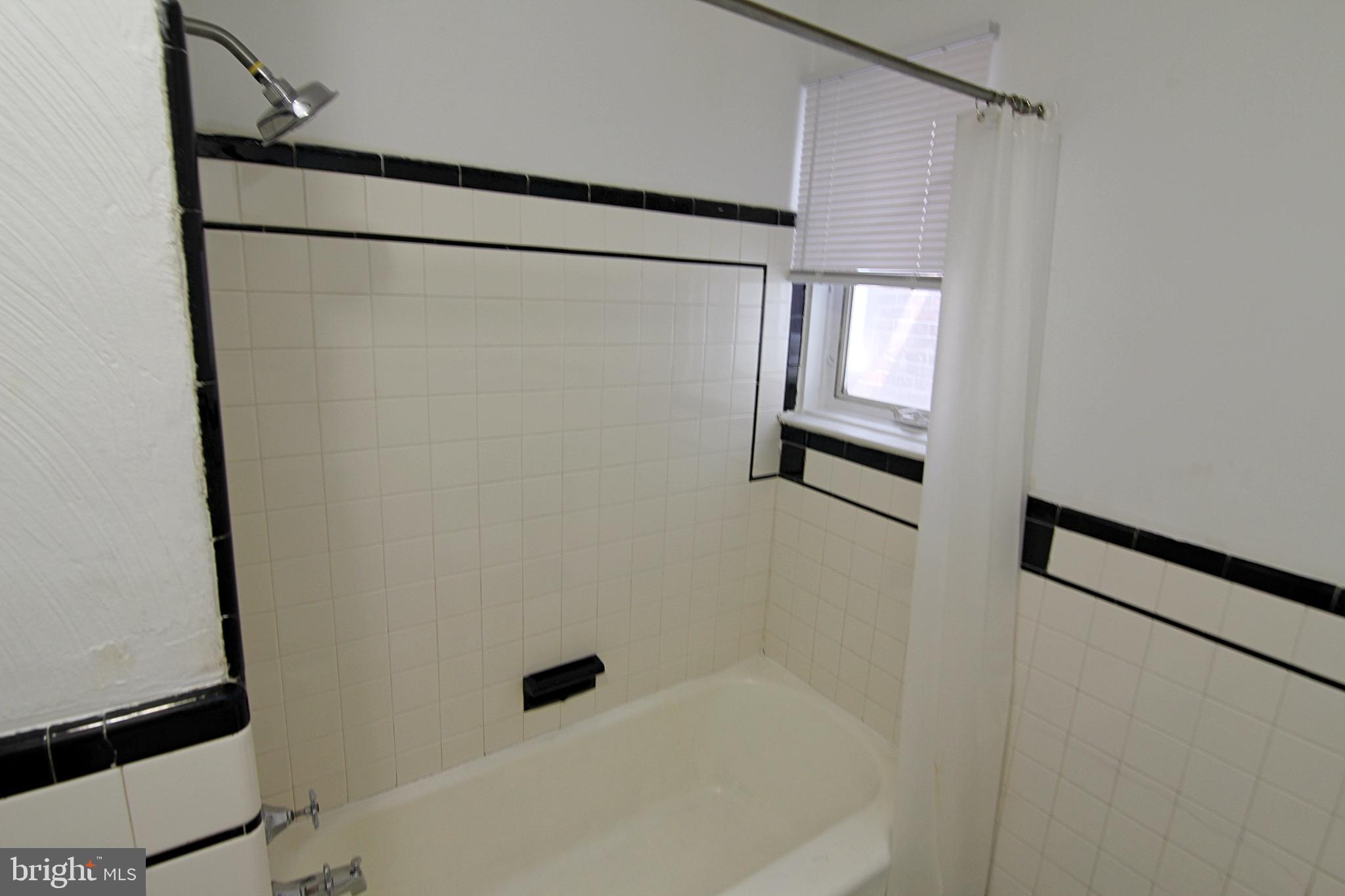 135 West 4th Street, Unit 2E Bridgeport, PA 19405 - Photo 9 of 11 a bathroom with a shower