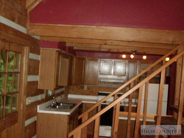 1088 Sugarloaf Road Boone, NC 28607 - Photo 3 of 8 a room with wooden floor and furniture