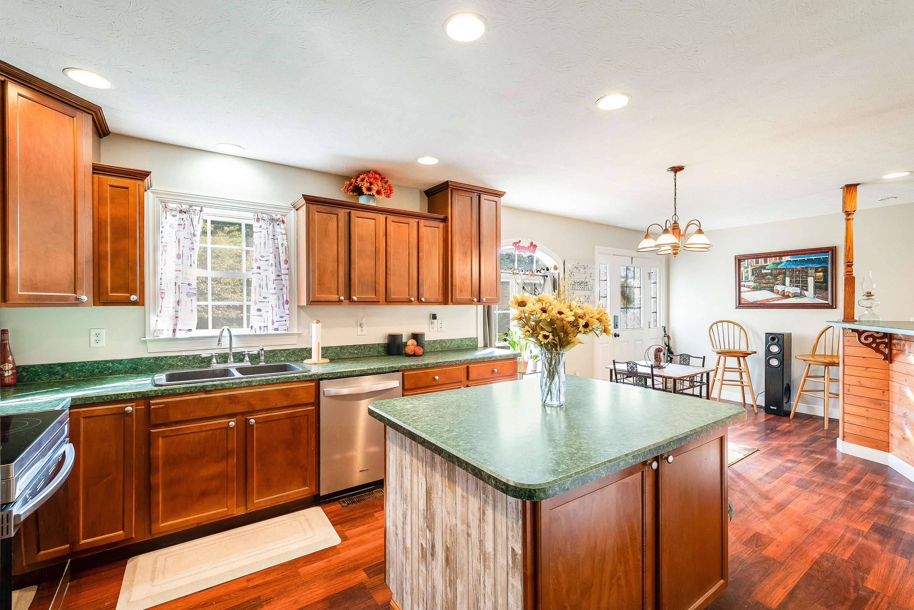 468 Paine Run Road Grottoes, VA 24441 - Photo 11 of 31 a kitchen with granite countertop a sink dishwasher stove and cabinets with wooden floor