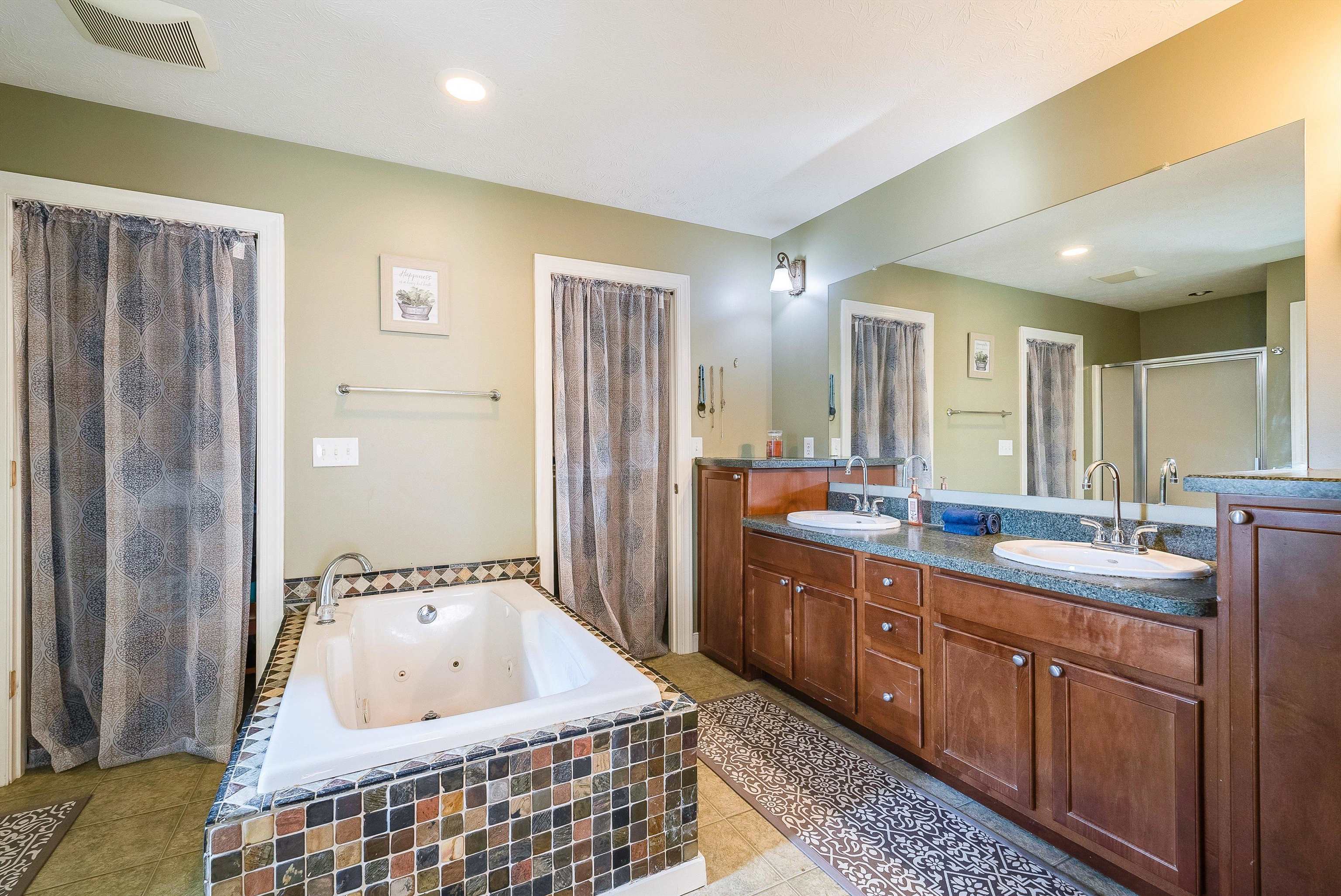 468 Paine Run Road Grottoes, VA 24441 - Photo 14 of 31 a bathroom with a tub a sink and mirror
