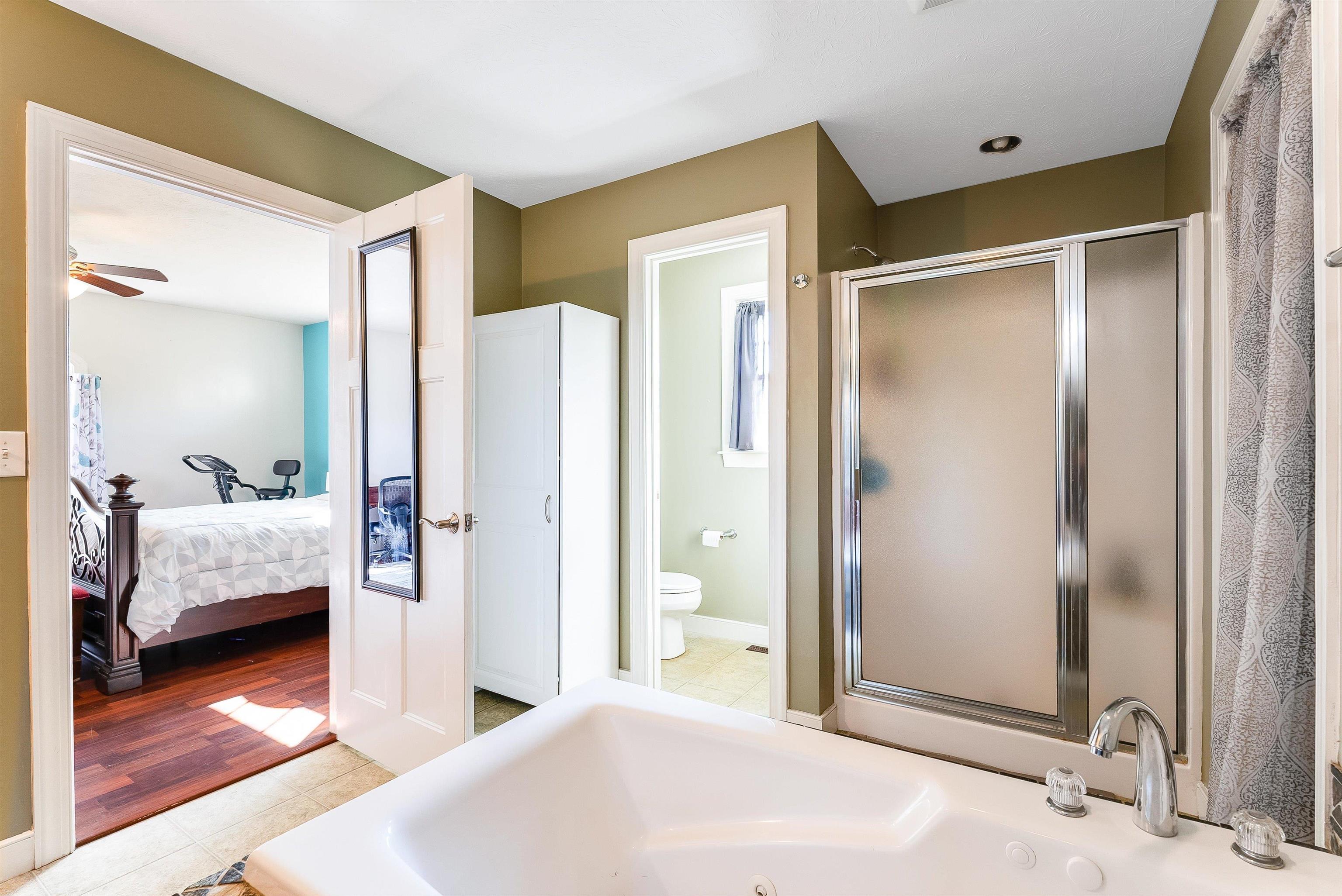 468 Paine Run Road Grottoes, VA 24441 - Photo 15 of 31 a bedroom with a bed and a large mirror