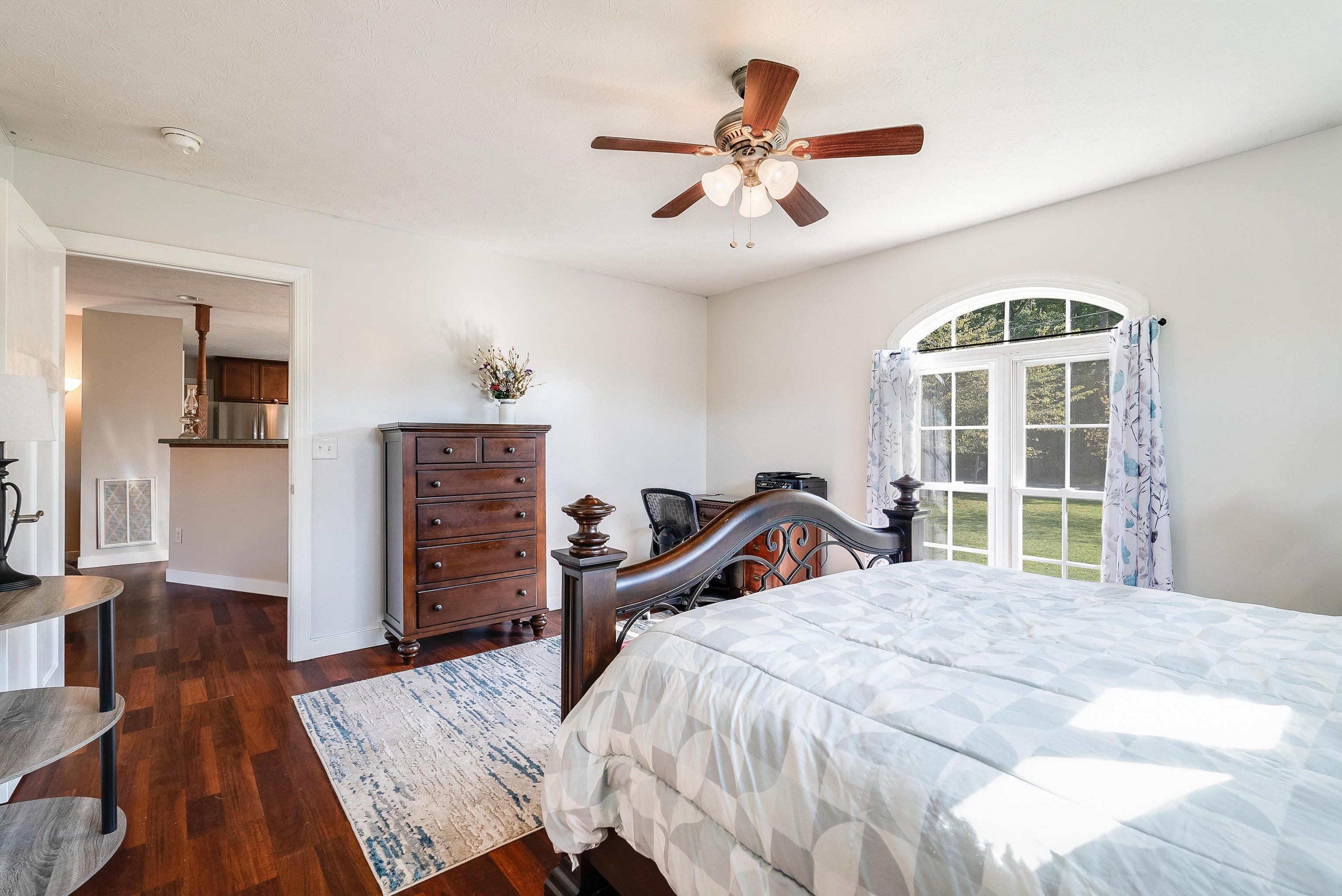 468 Paine Run Road Grottoes, VA 24441 - Photo 16 of 31 a bedroom with a bed and wooden floor