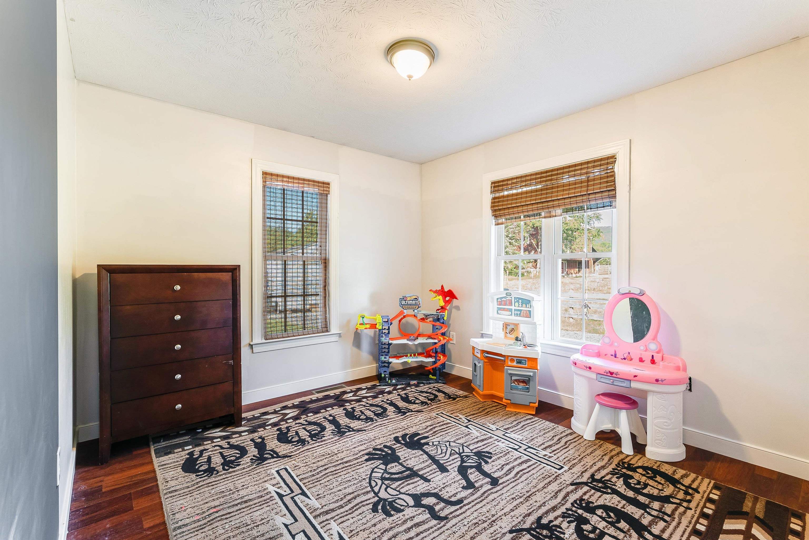 468 Paine Run Road Grottoes, VA 24441 - Photo 27 of 31 a bedroom with a bed and wooden floor