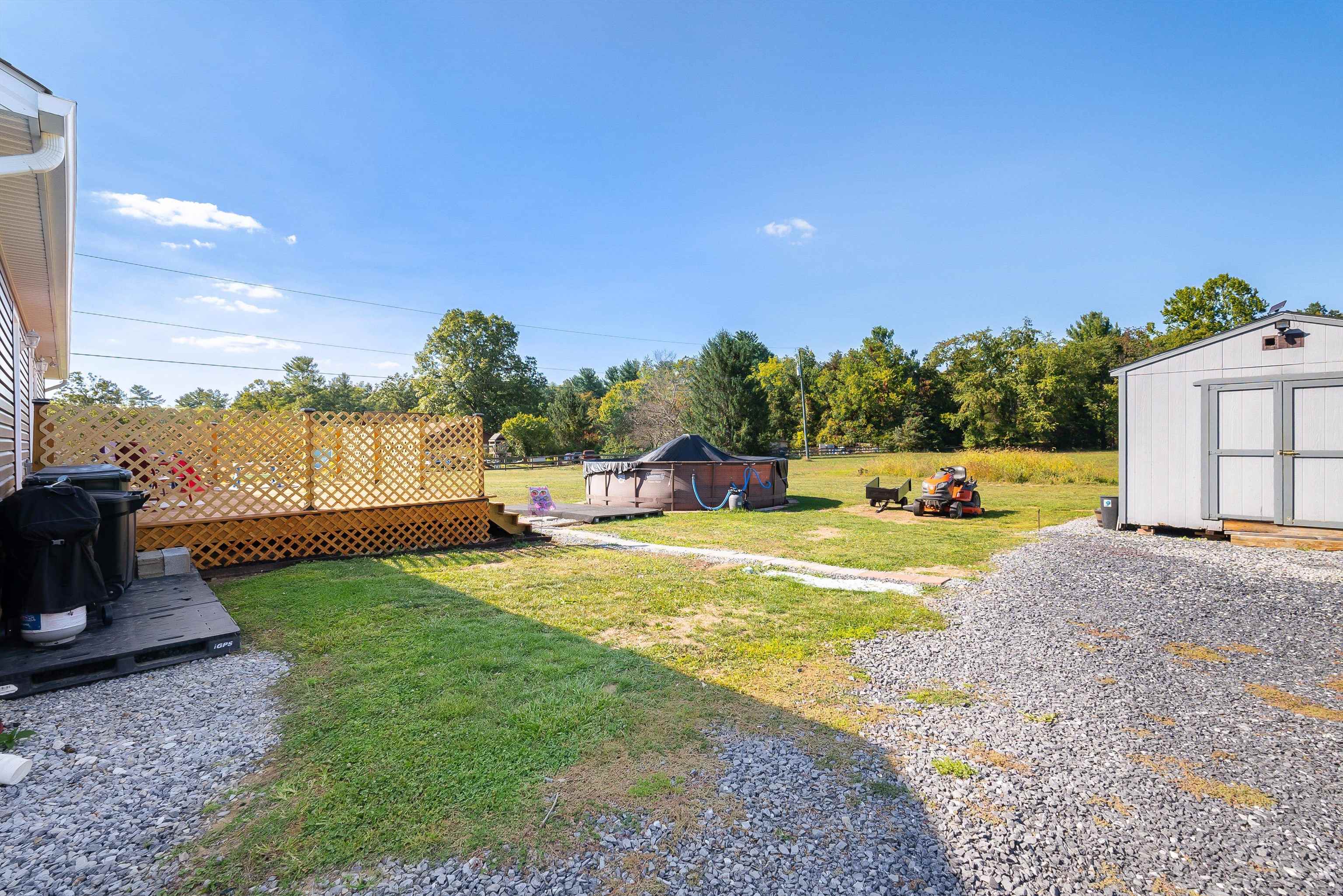 468 Paine Run Road Grottoes, VA 24441 - Photo 4 of 31 a swimming pool with outdoor seating and yard