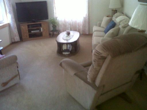 829 North 12th Street Rochelle, IL 61068 - Photo 3 of 11 a living room with furniture and a flat screen tv