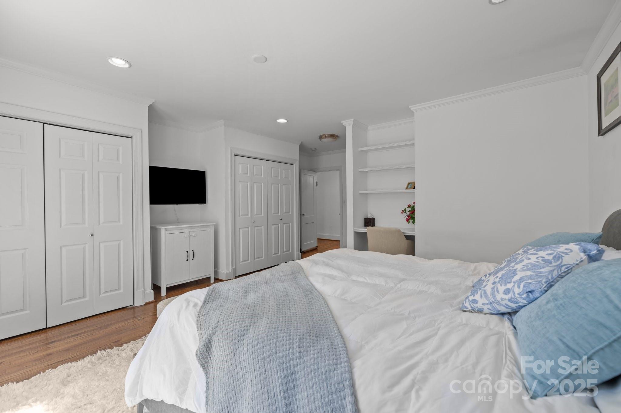 3019 Sunset Drive Charlotte, NC 28209 - Photo 15 of 46 a bedroom with a bed and a flat tv screen in it