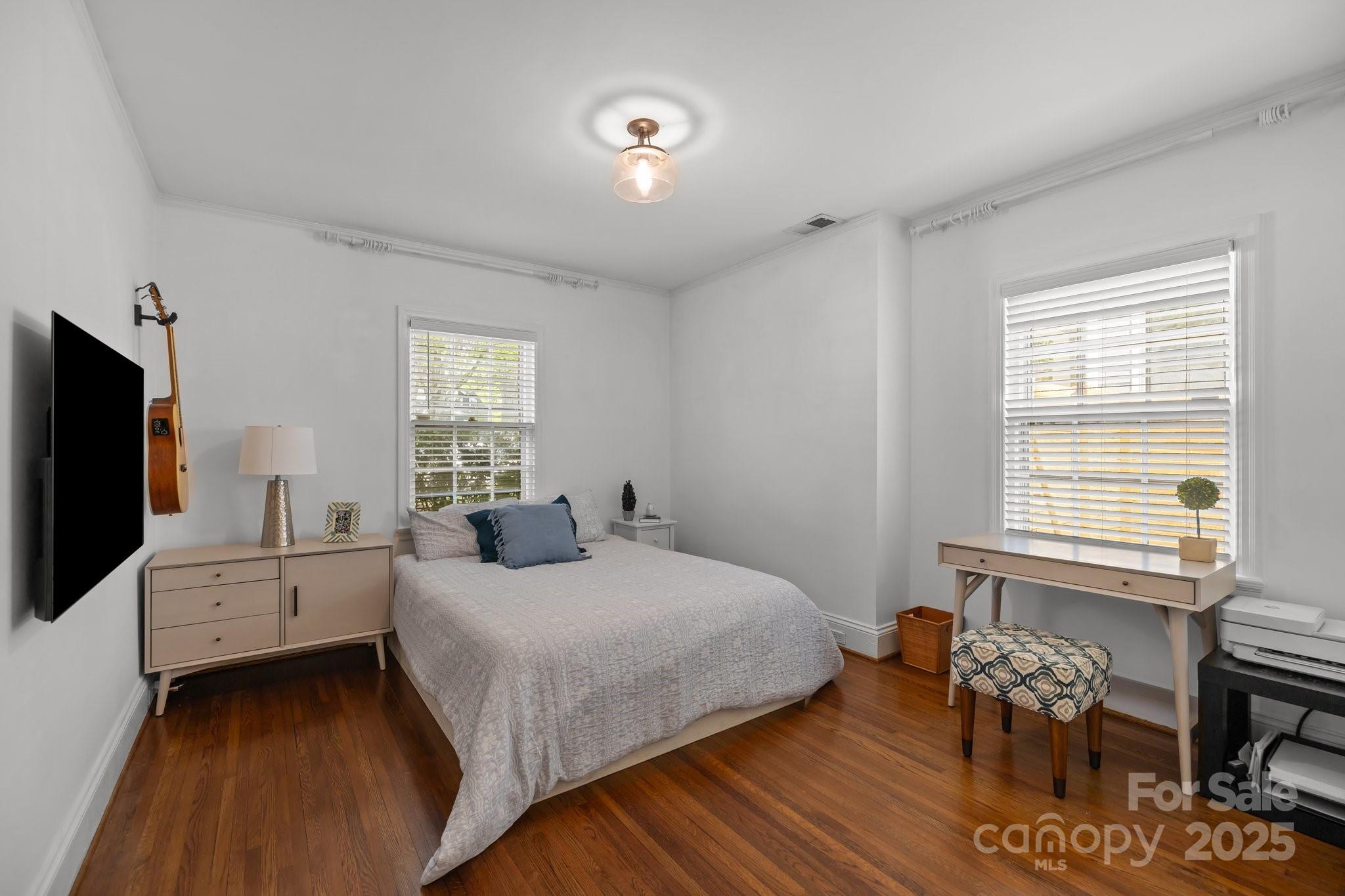 3019 Sunset Drive Charlotte, NC 28209 - Photo 21 of 46 a bedroom with a bed and a flat screen tv