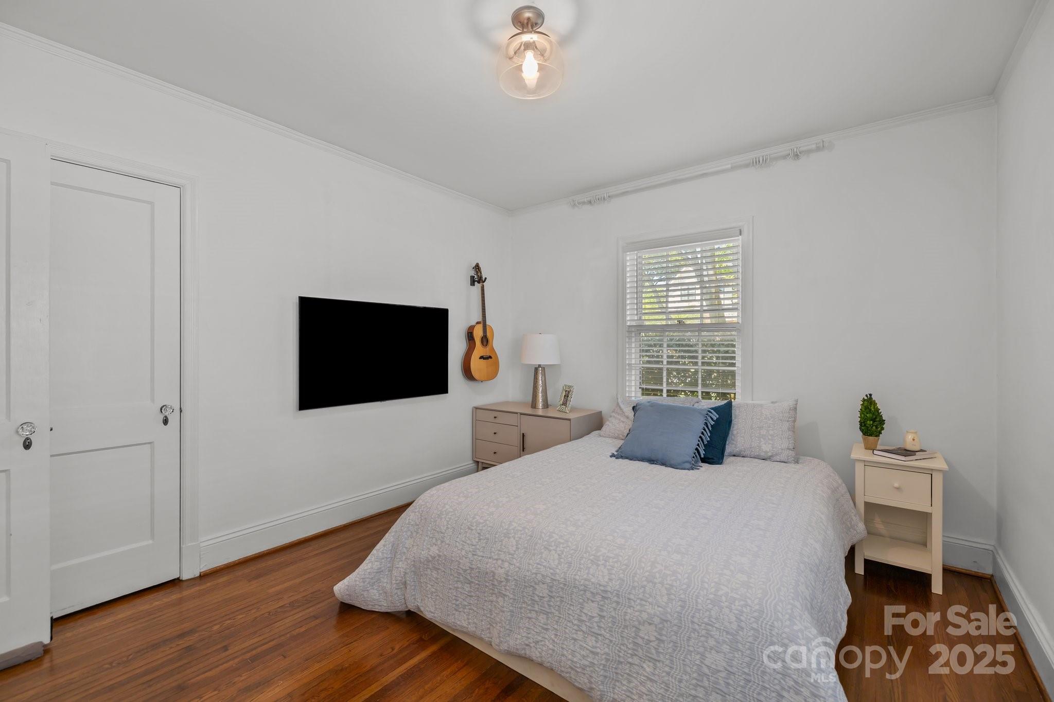 3019 Sunset Drive Charlotte, NC 28209 - Photo 22 of 46 a bedroom with a bed and a flat screen tv