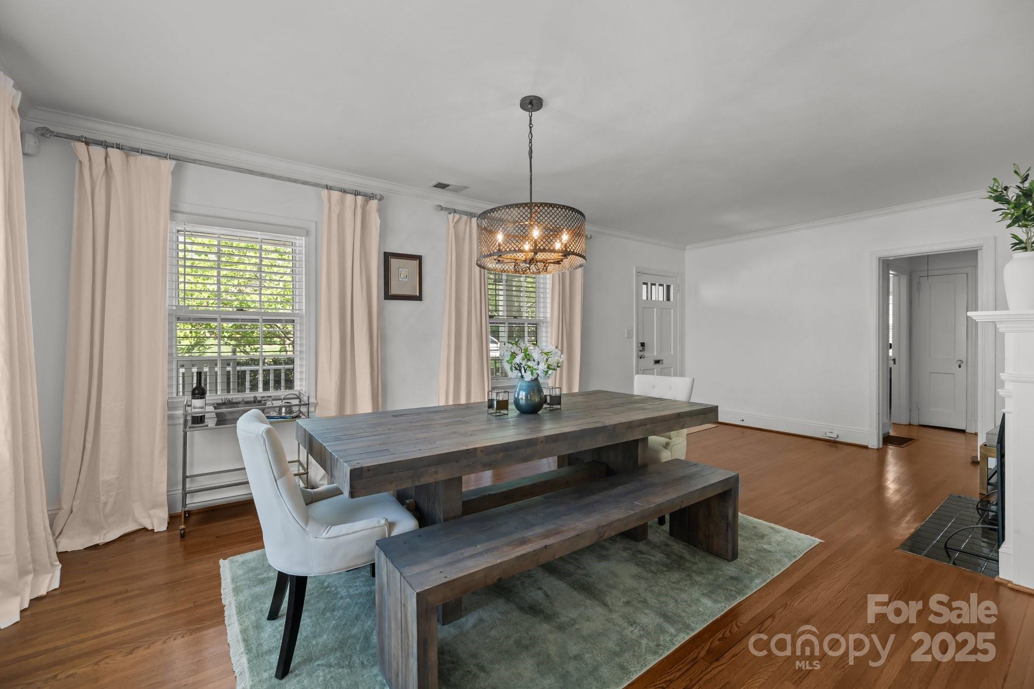 3019 Sunset Drive Charlotte, NC 28209 - Photo 25 of 46 a living room with a table and a chandelier