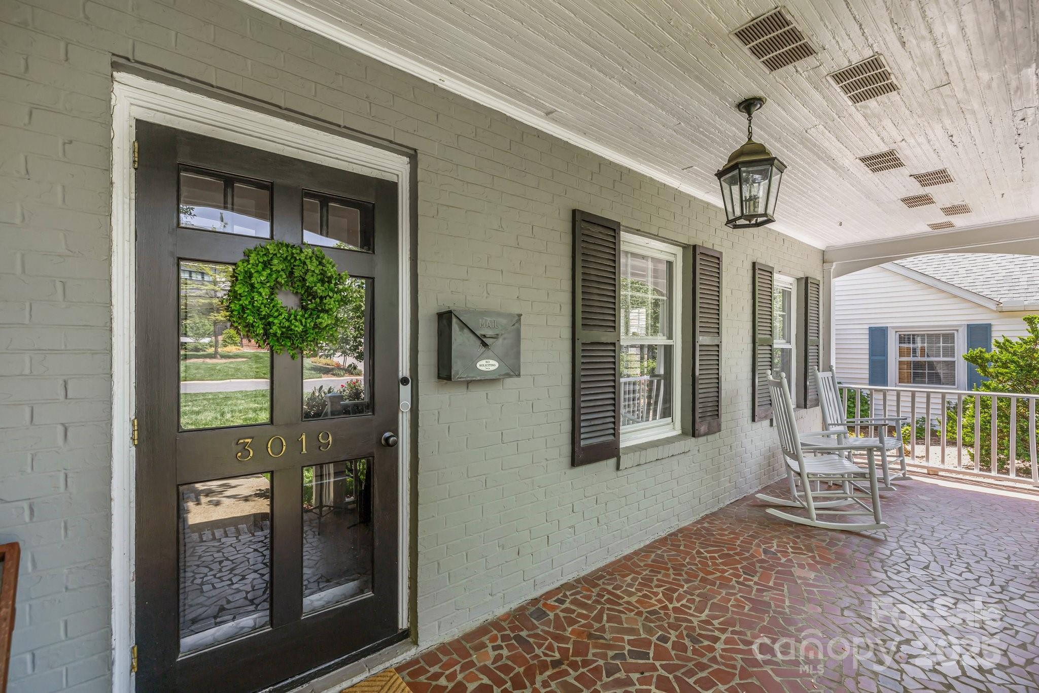 3019 Sunset Drive Charlotte, NC 28209 - Photo 40 of 46 a view of a porch with a table and chairs