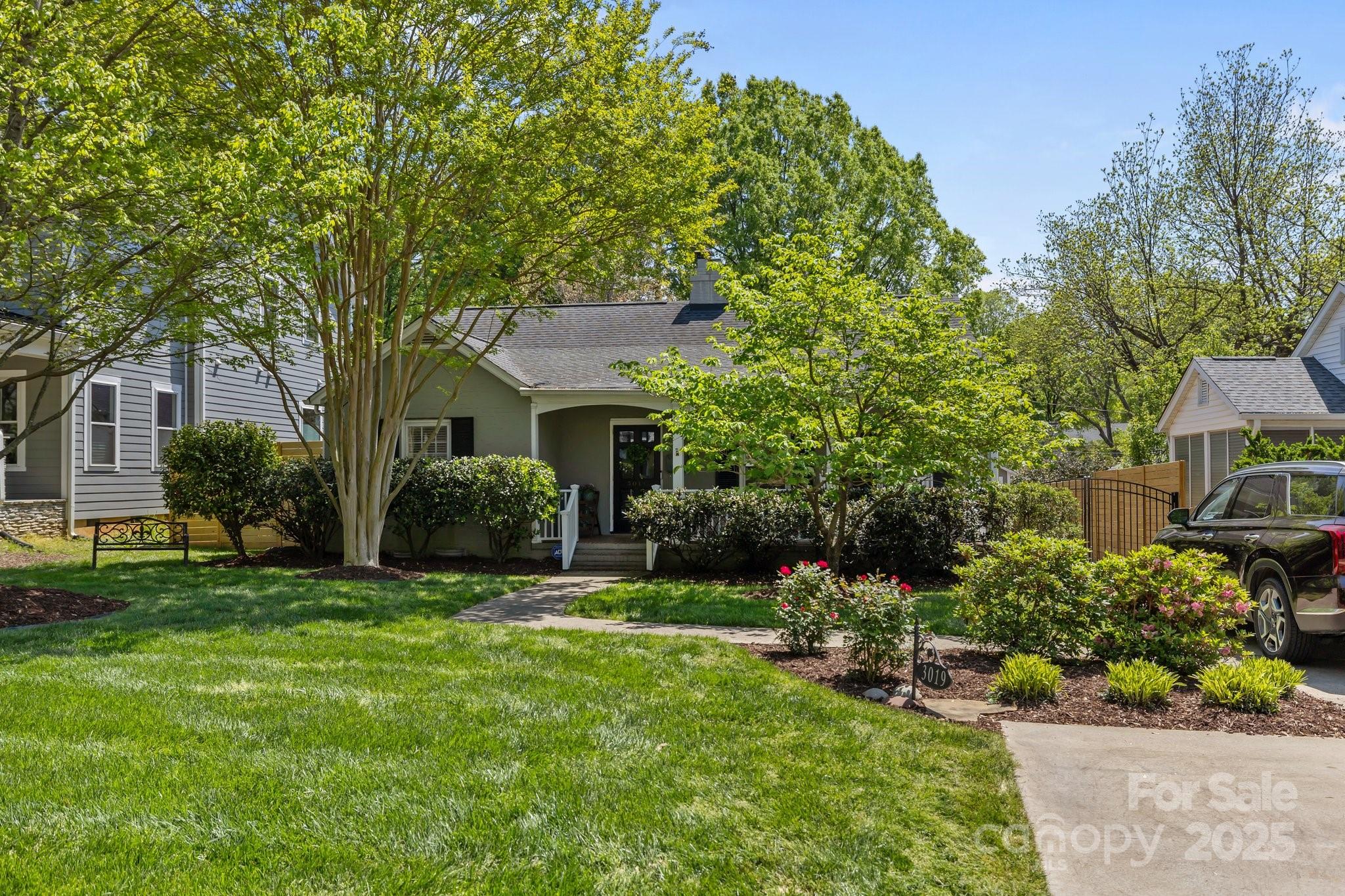 3019 Sunset Drive Charlotte, NC 28209 - Photo 4 of 46 a front view of a house with a garden