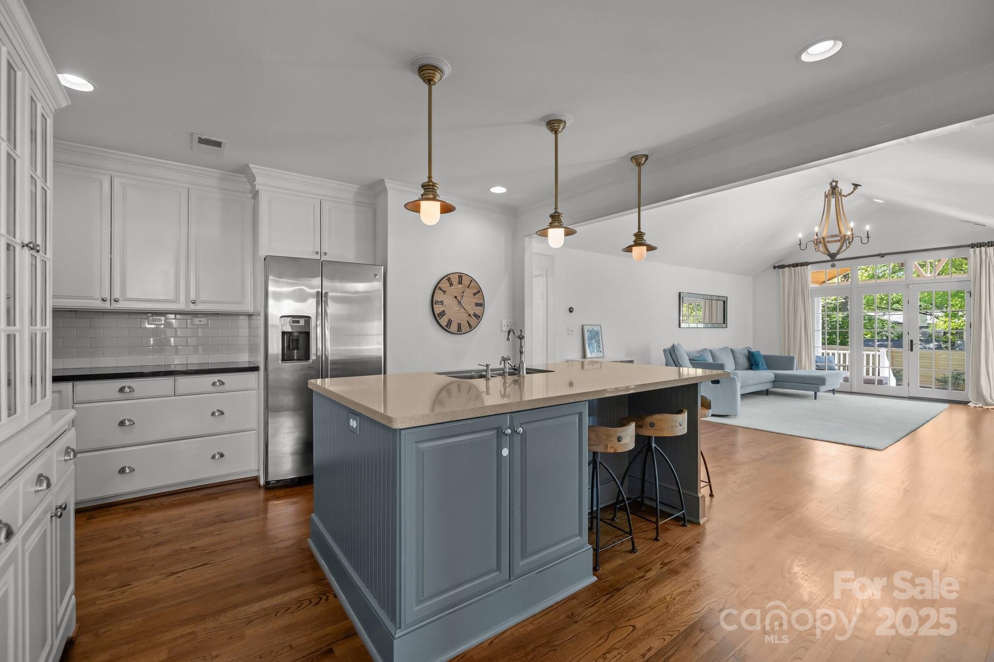 3019 Sunset Drive Charlotte, NC 28209 - Photo 5 of 46 a kitchen with stainless steel appliances granite countertop a sink a stove and a wooden floors