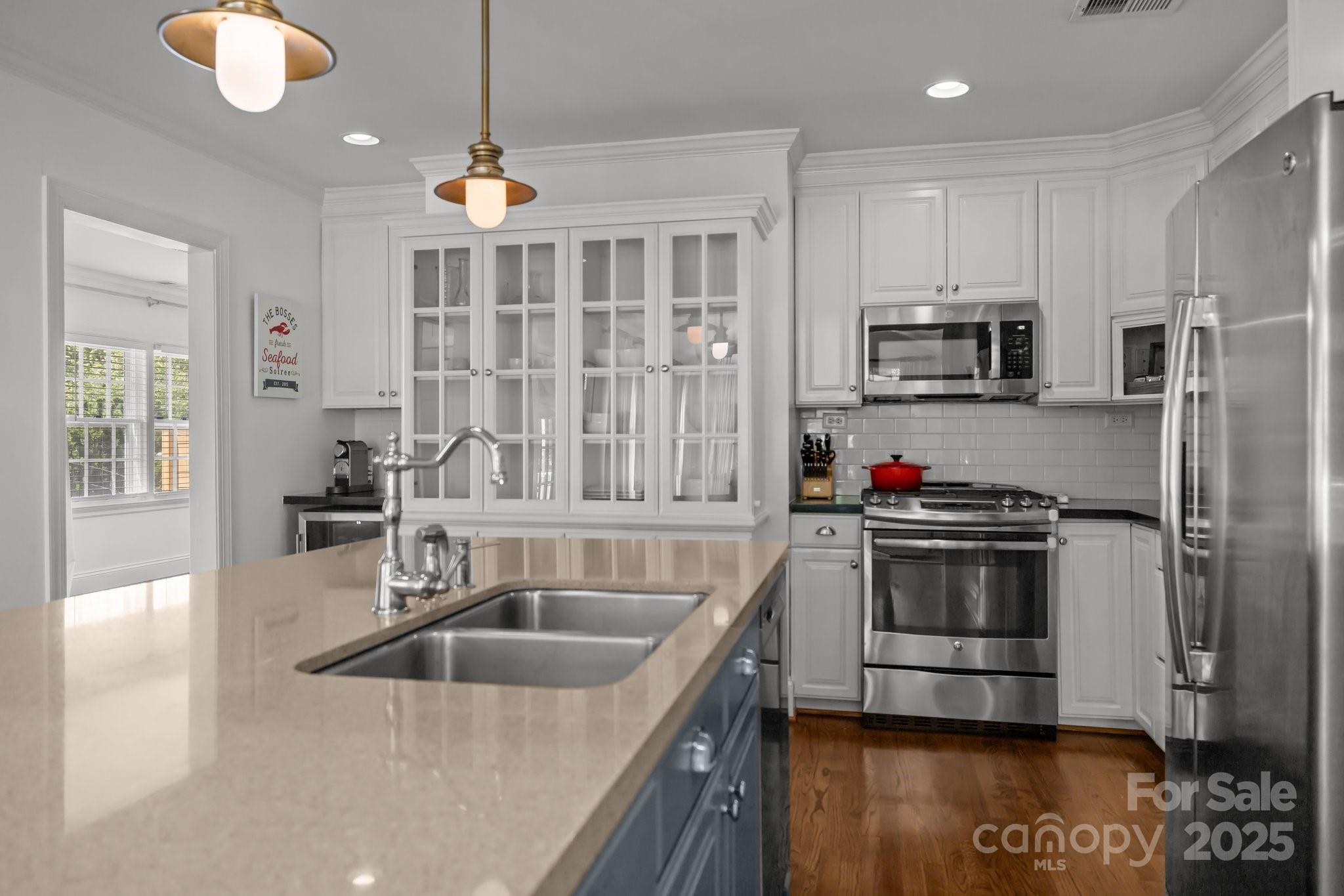 3019 Sunset Drive Charlotte, NC 28209 - Photo 7 of 46 a kitchen that has a sink cabinets counter space and stainless steel appliances