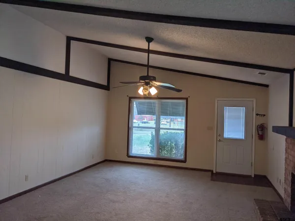 a view of an empty room with windows