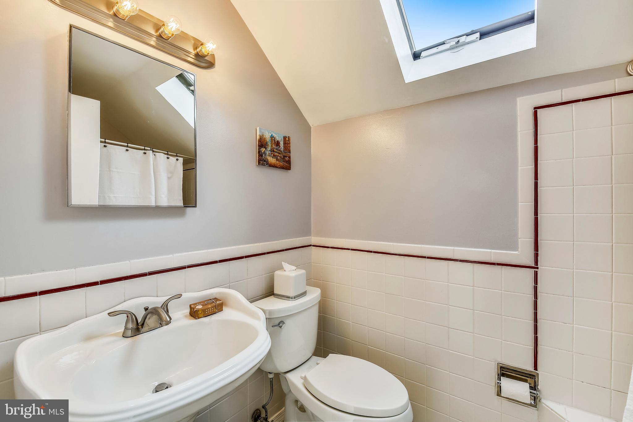 8801 Cold Spring Road Potomac, MD 20854 - Photo 29 of 44 a bathroom with a sink mirror and toilet