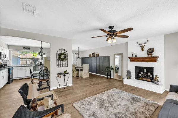 a living room with furniture and a fireplace