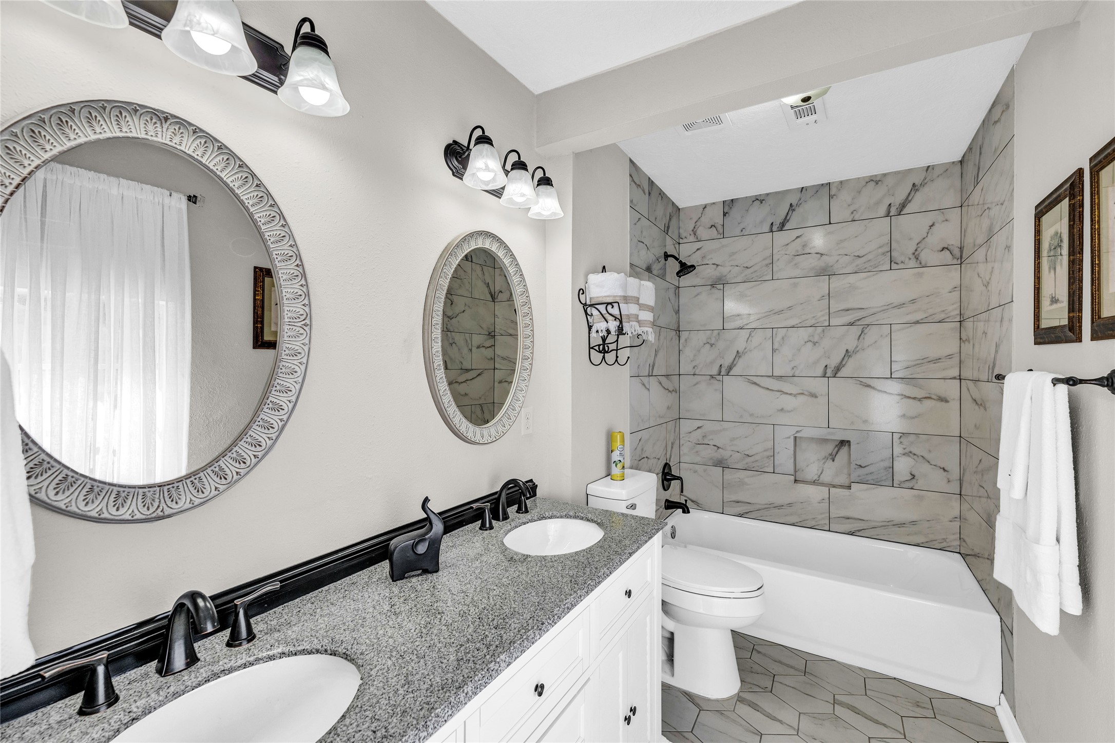 2705 Parrott Avenue Rosenberg, TX 77471 - Photo 19 of 27 a bathroom with a granite countertop toilet a sink and bathtub